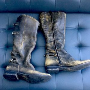 Distressed leather boots with buckles up the back